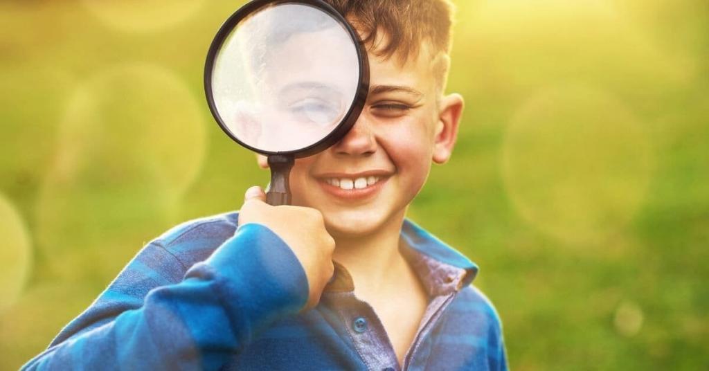 little boy with a magnifying glass