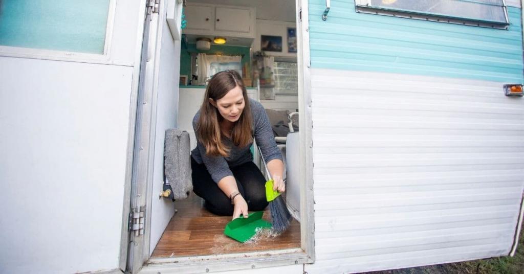 woman cleaning an RV