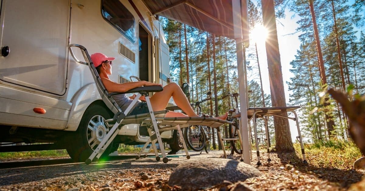 woman sitting in camping chair