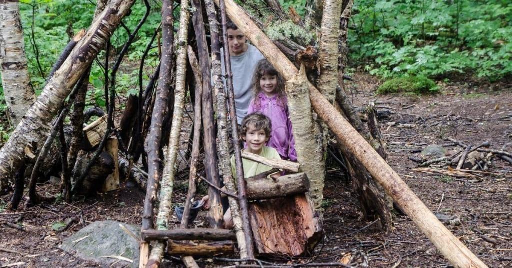 kids building a shelter in the woods
