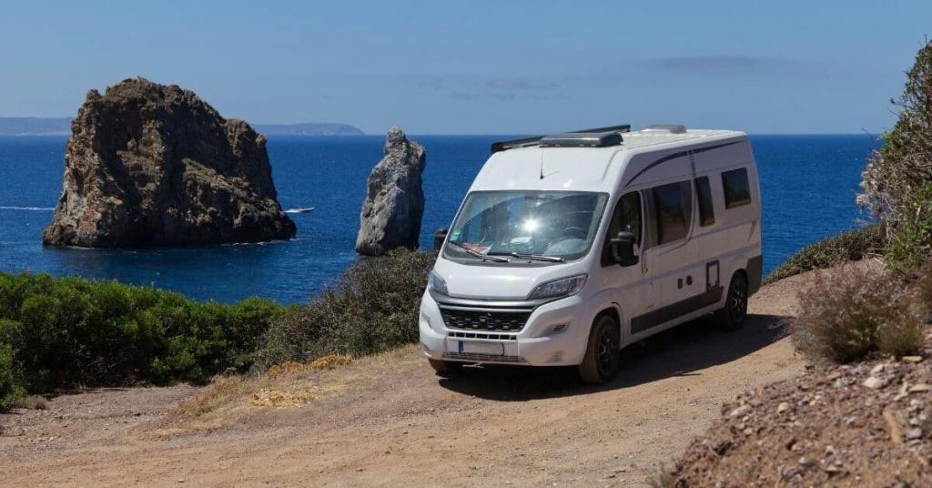 camper van parked by the ocean