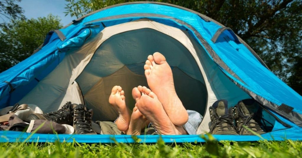 tent with feet sticking out